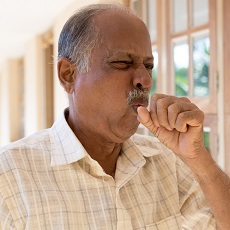 man with Chronic Bronchitis coughing